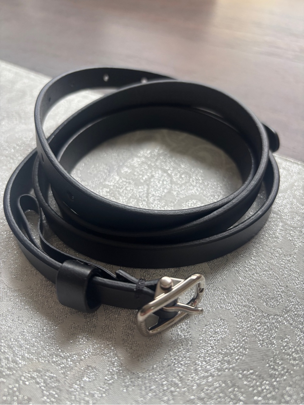 Burberry slim black Leather Belt with Silver Buckle.